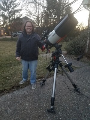 Steve Katsikas Next to a Telescope