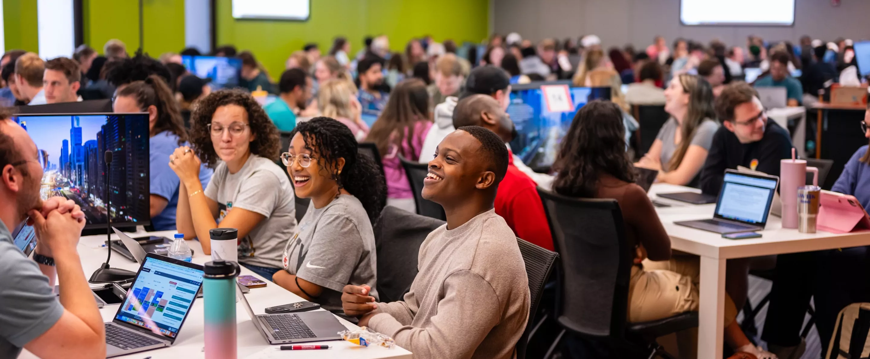 Students in a lecture in the School of Medicine, working in tables and interacting