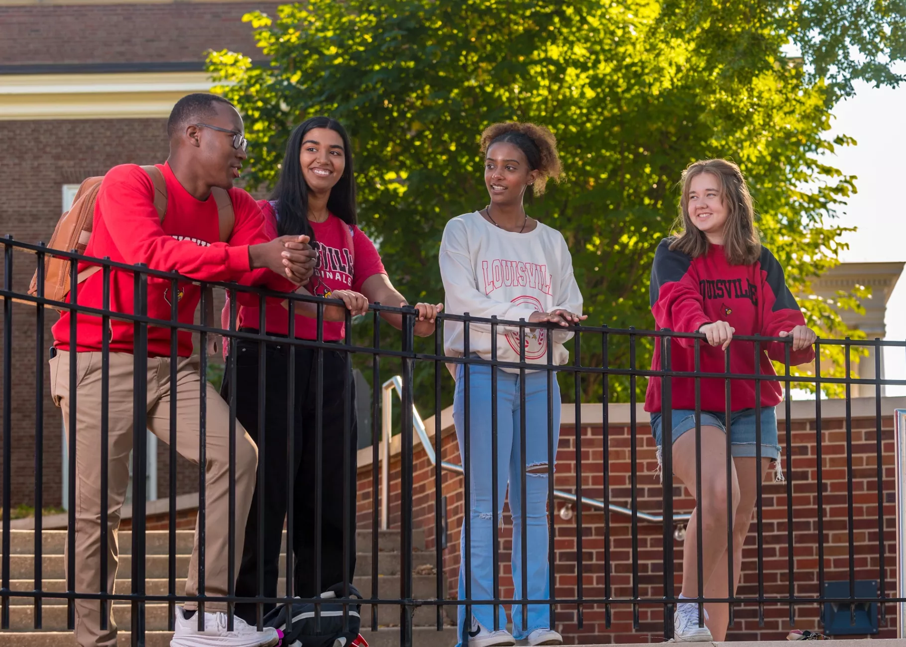 A group of students talking on campus