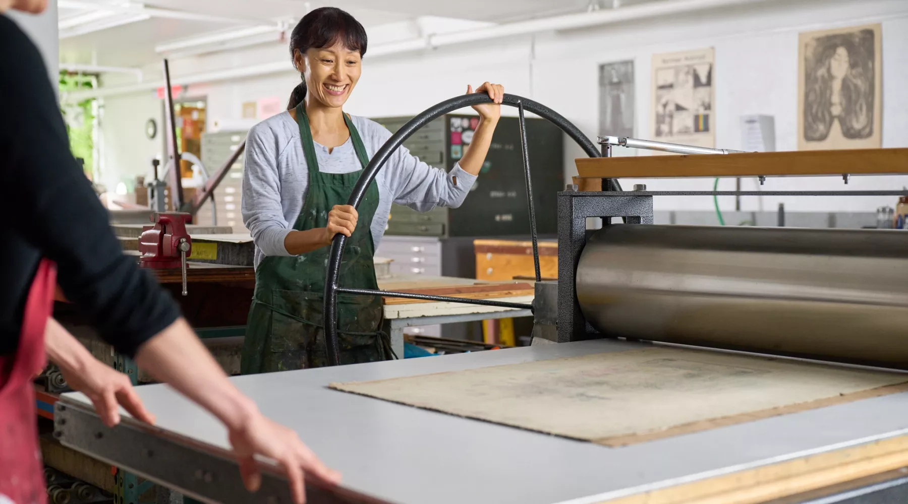 Printmaking student in a studio class with Rachel Singel, Associate Professor