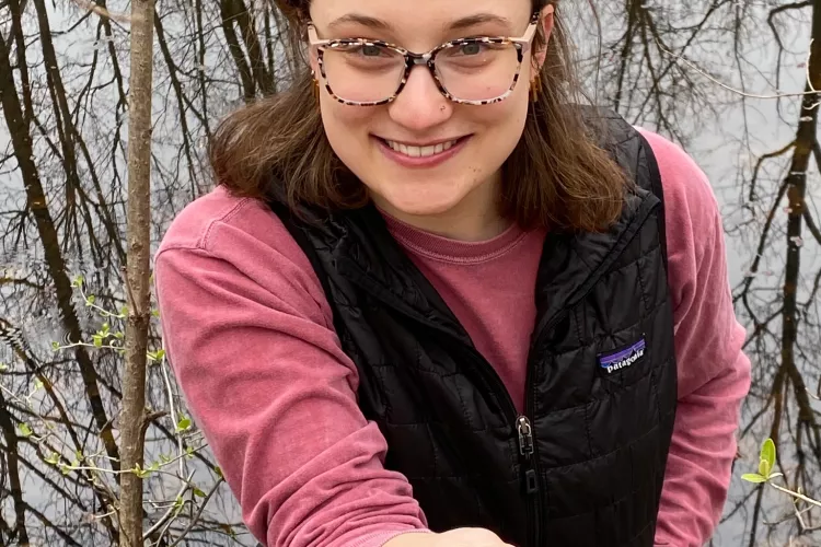 Shayna Earl holds salamander eggs at Horner Bird and Wildlife Sanctuary.