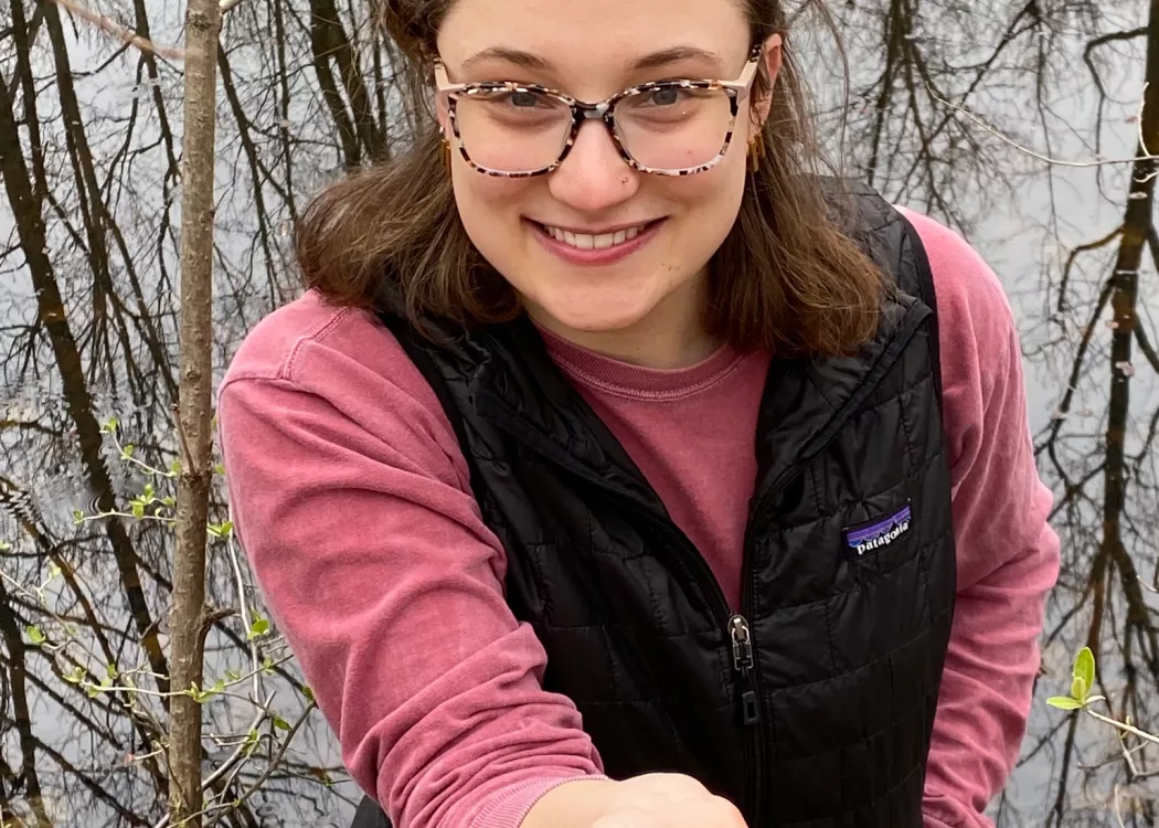 Shayna Earl holds salamander eggs at Horner Bird and Wildlife Sanctuary.