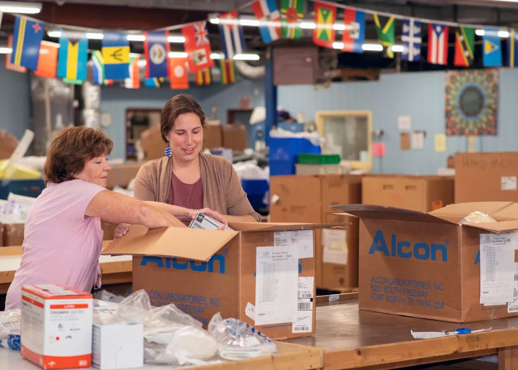 Denise Sears, left, president of SOS International, and Bethany Hodge, director of the UofL School of Medicine Global…