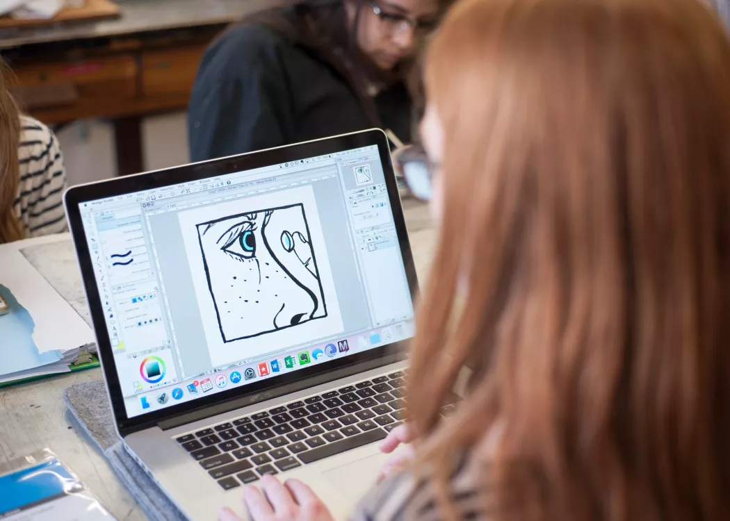Student works on a project in printmaking