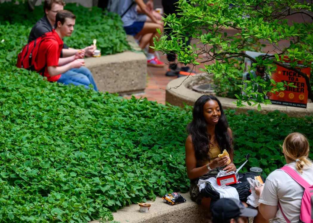 Students eating outside of the College of Business.